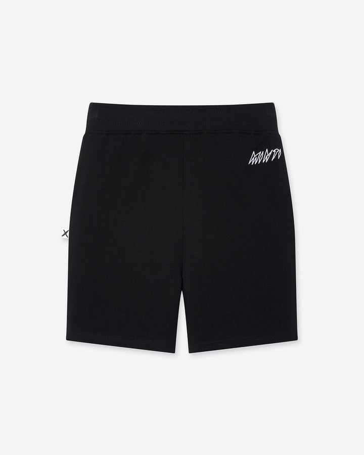 Hero Short in black, boys shorts by Minti, flat lay, back view