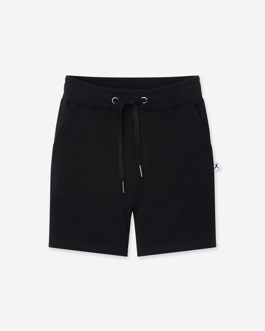 Hero Short in black, boys shorts by Minti, flat lay