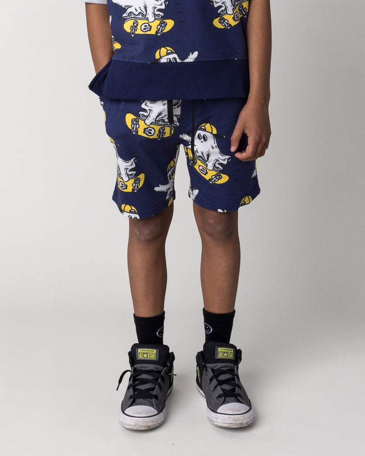 Kid wearing the Skate Ghost Short in dark blue, front view close up