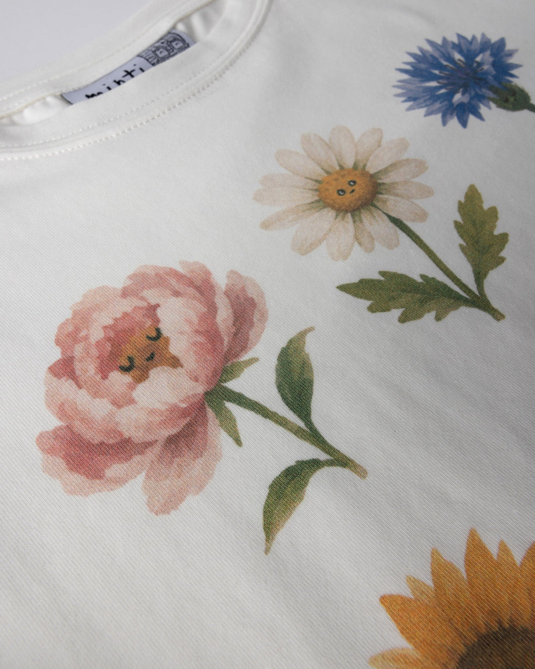 Close up of the Flower Friends Cropped Tee print in white