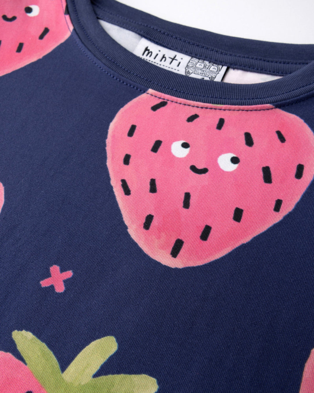 Close up detail of the Happy Strawberry Cropped Tee in turquoise