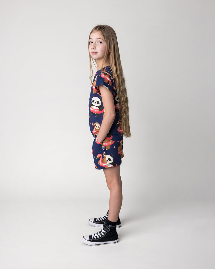 Kid wearing the Swimming Buddies Short in midnight with the Swimming Buddies Tee in midnight, side view
