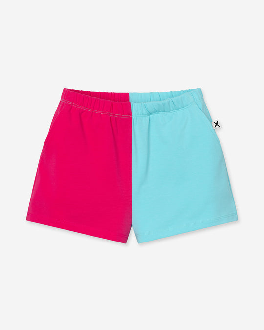 Two Tone Short in hot pink and aqua, girls shorts by Minti, flat lay
