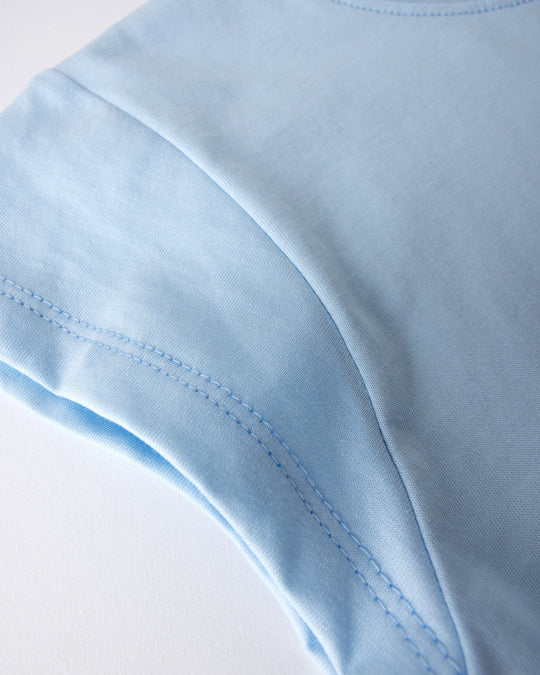 Close up detail of the Flower Penguin Tee in light blue