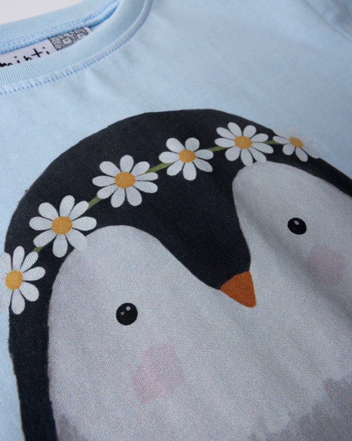 Close up of the Flower Penguin Tee print in light blue