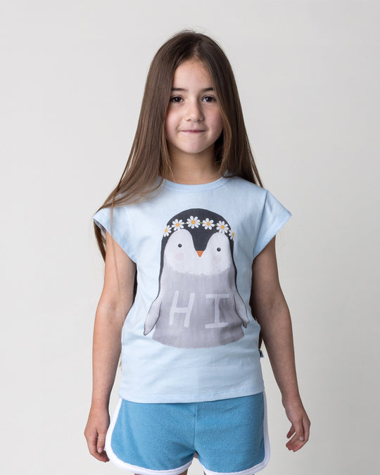 Close up of the Flower Penguin Tee in light blue on a kid, front view