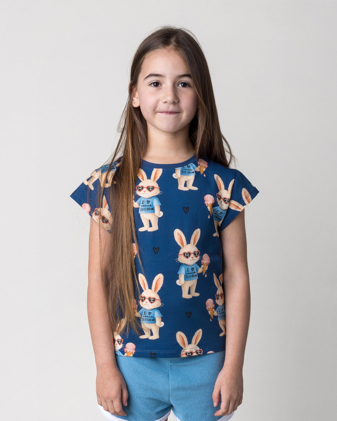 Close up of the Icecream Bunny Tee in blue on a kid, front view