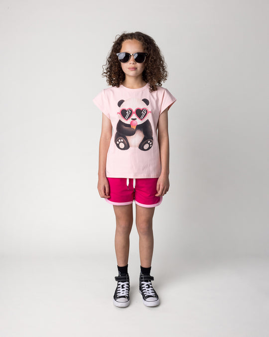 Kid wearing the Icecream Panda Tee in light pink with the Sprint Short in crimson and pink, front view