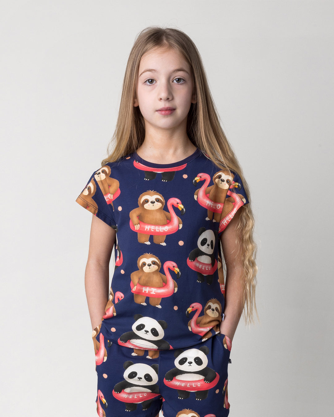 Close up of the Swimming Buddies Tee in midnight on a kid, front view