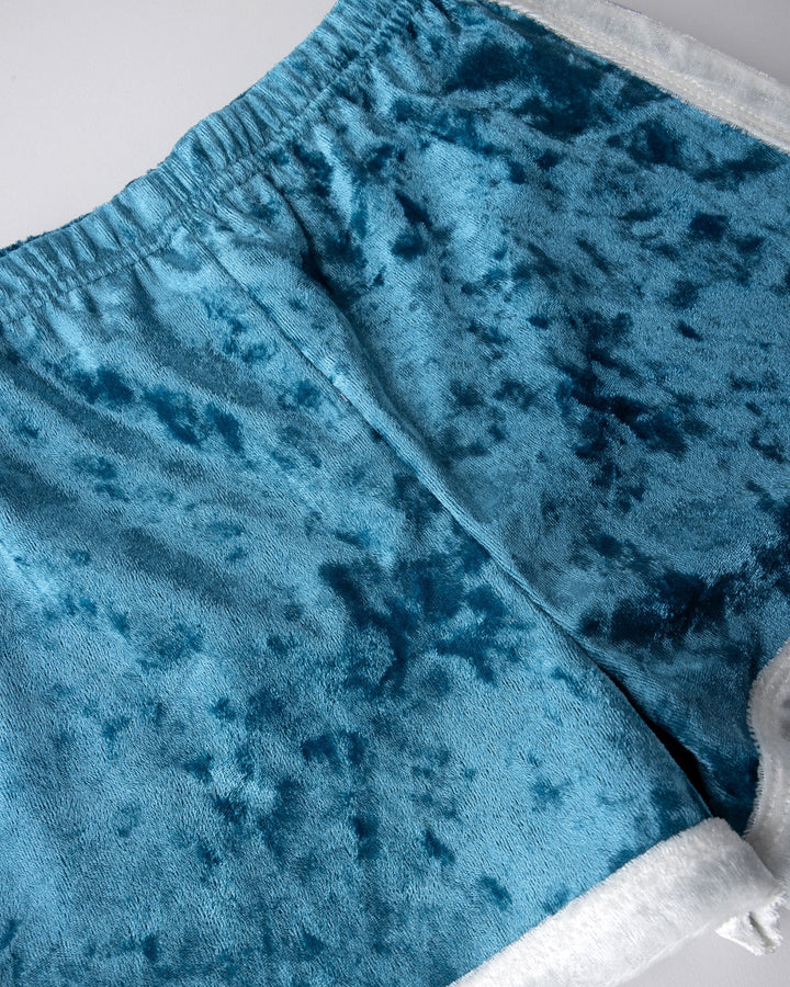 Close up detail of the Velvet Runner Short in light blue and cream