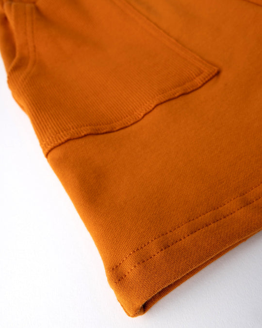 Close up detail of the Rib Pocket Short in burnt orange