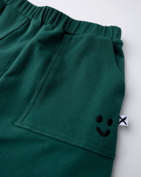 Close up detail of the Rib Pocket Short in kelly green