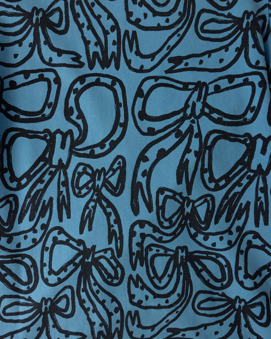 Close up of the Big Bows Dress print in blue wash