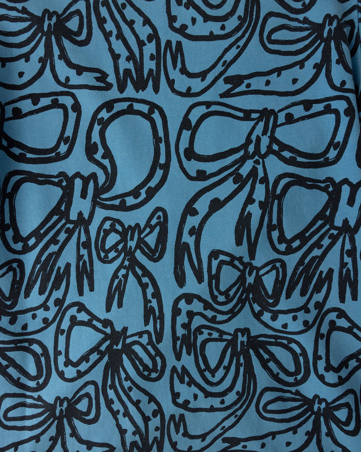 Close up of the Big Bows Dress print in blue wash