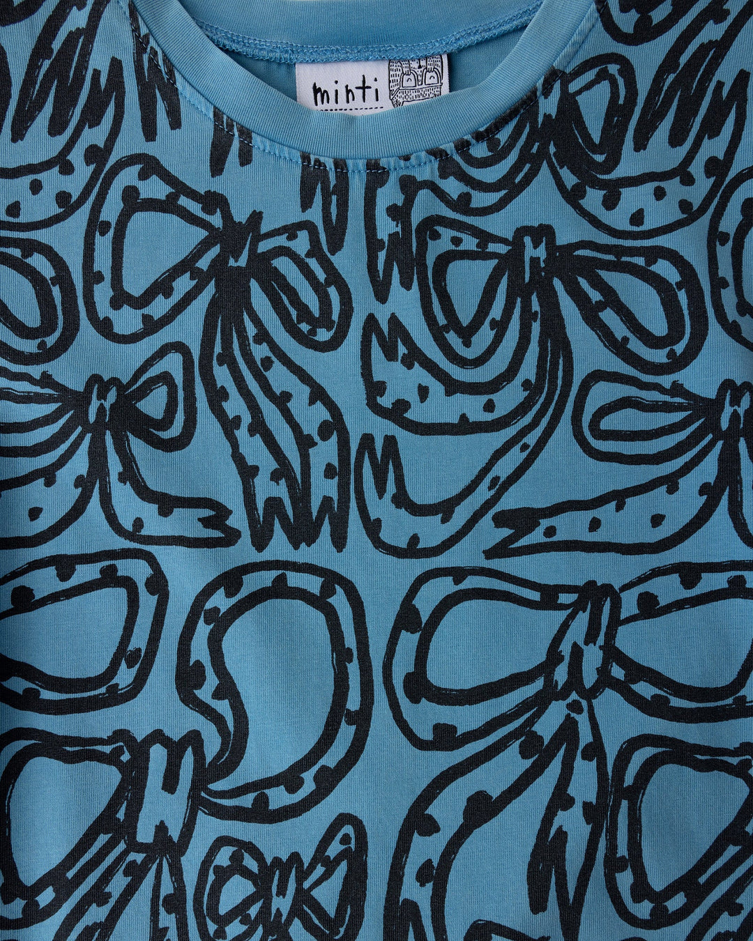 Close up of the Big Bows Dress print in blue wash