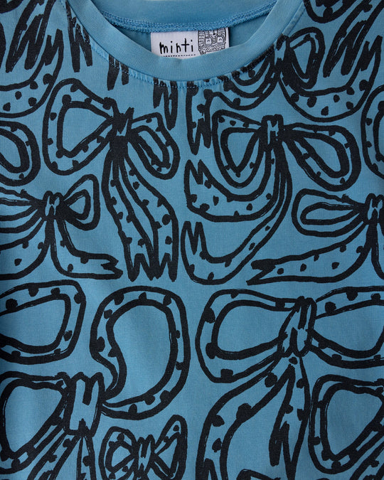 Close up of the Big Bows Dress print in blue wash