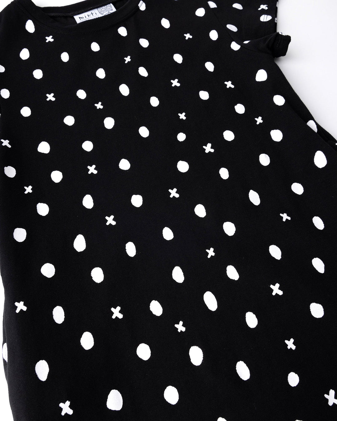 Close up of the Spotty Dress print in black