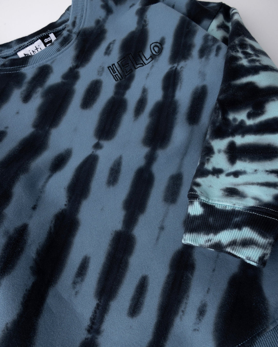 Close up of the Duo Tie Dye Crew print in blue and aqua