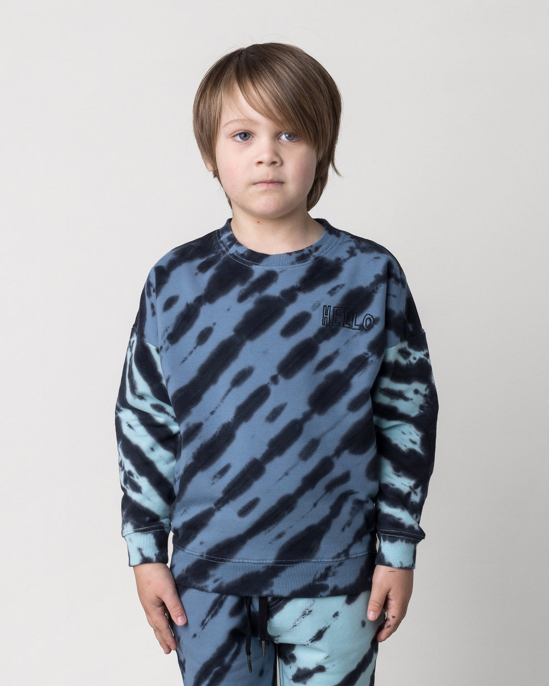 Close up of the Duo Tie Dye Crew in blue and aqua on a kid, front view