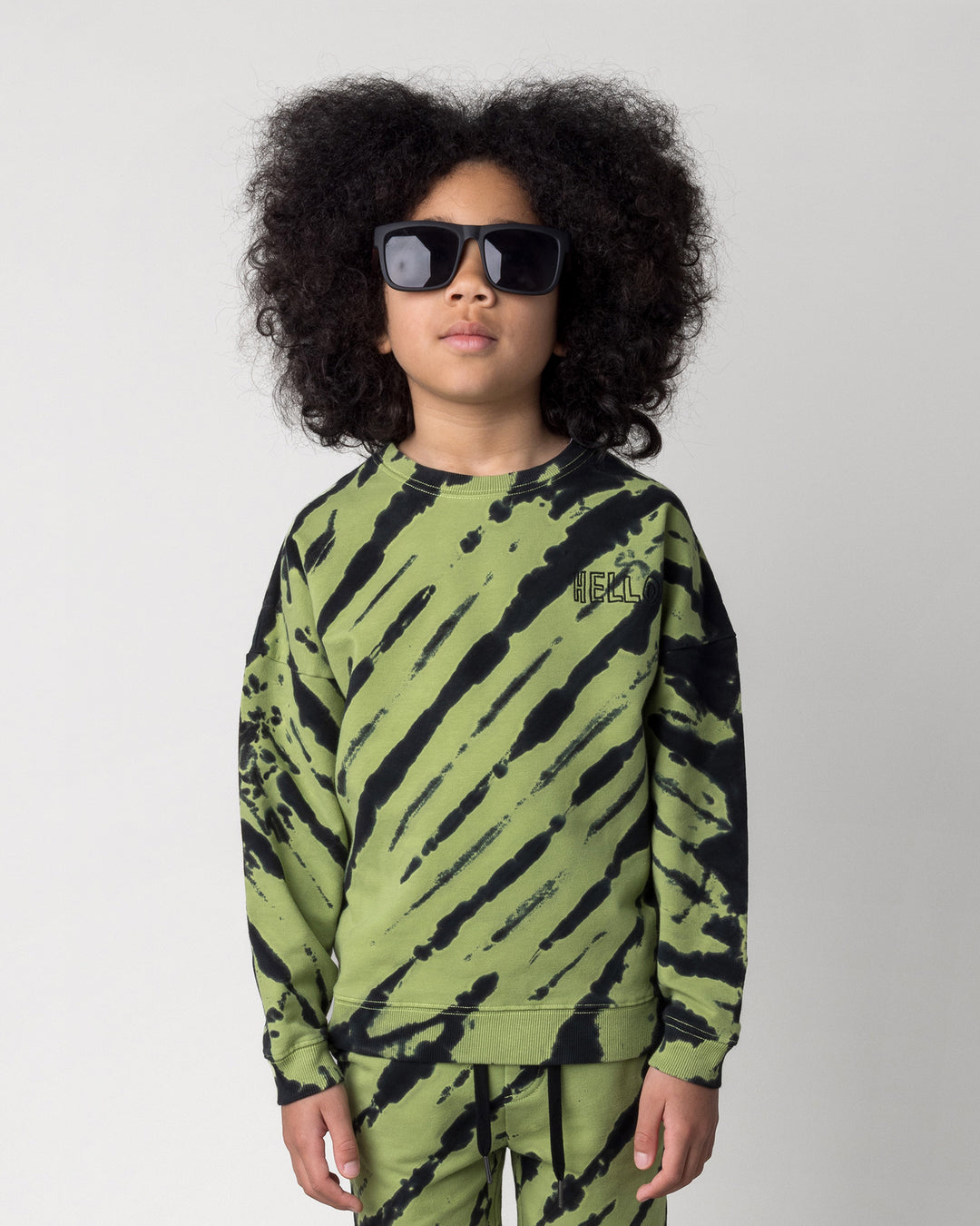 Close up of the Strike Crew in lime on a kid, front view