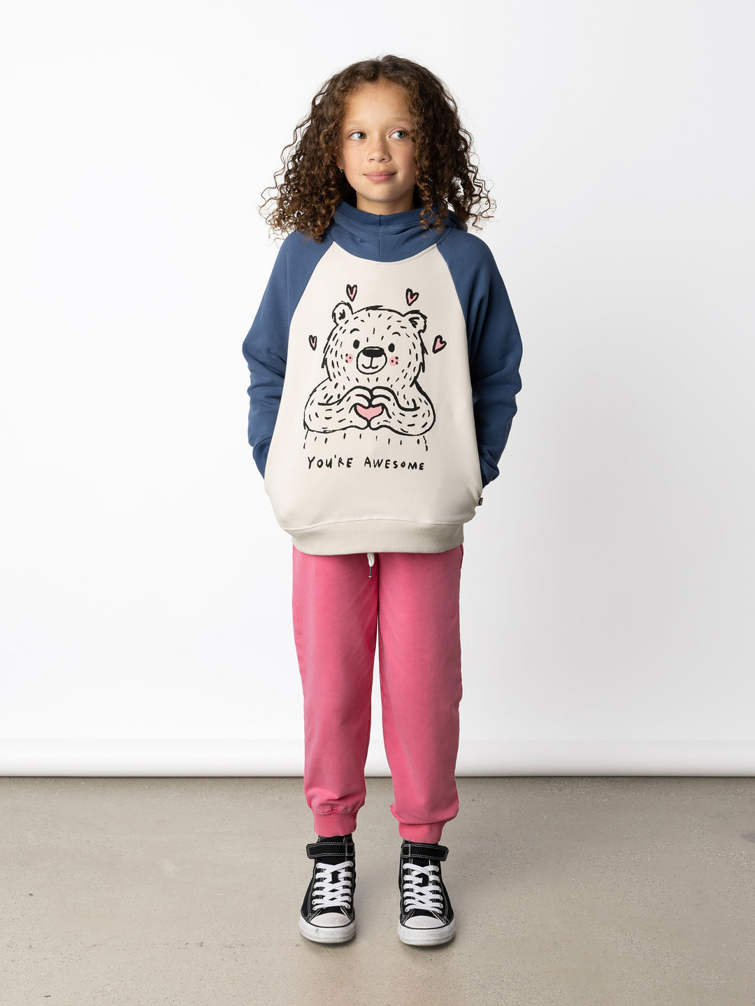 Minti kids clothing. Super soft hoodie with hidden pockets in the side seams. The ribbed-trim hood makes it extra cosy. Soft brushed 'furry' inside. 2x2 Rib at the neck, hem and cuffs. We recommend going up a size for this style. 330 Gram // Brushed Inside // 95% Cotton // 5% Elastane.