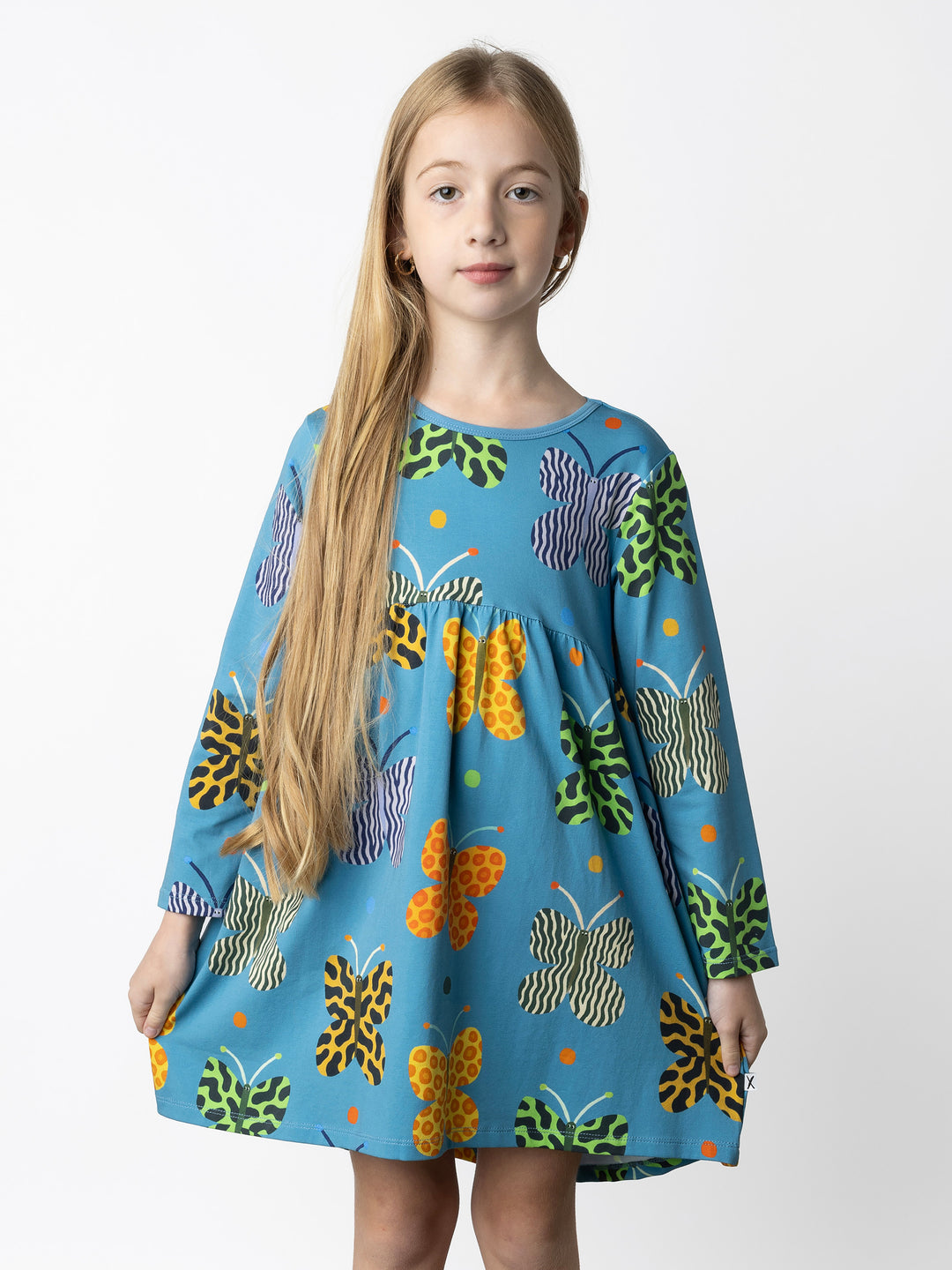 Minti kids clothing. Comfy tshirting weight dress with curved ruched front seam, hidden side pockets and scooped back hem. 190 Gram // 95% Cotton // 5% Elastane.