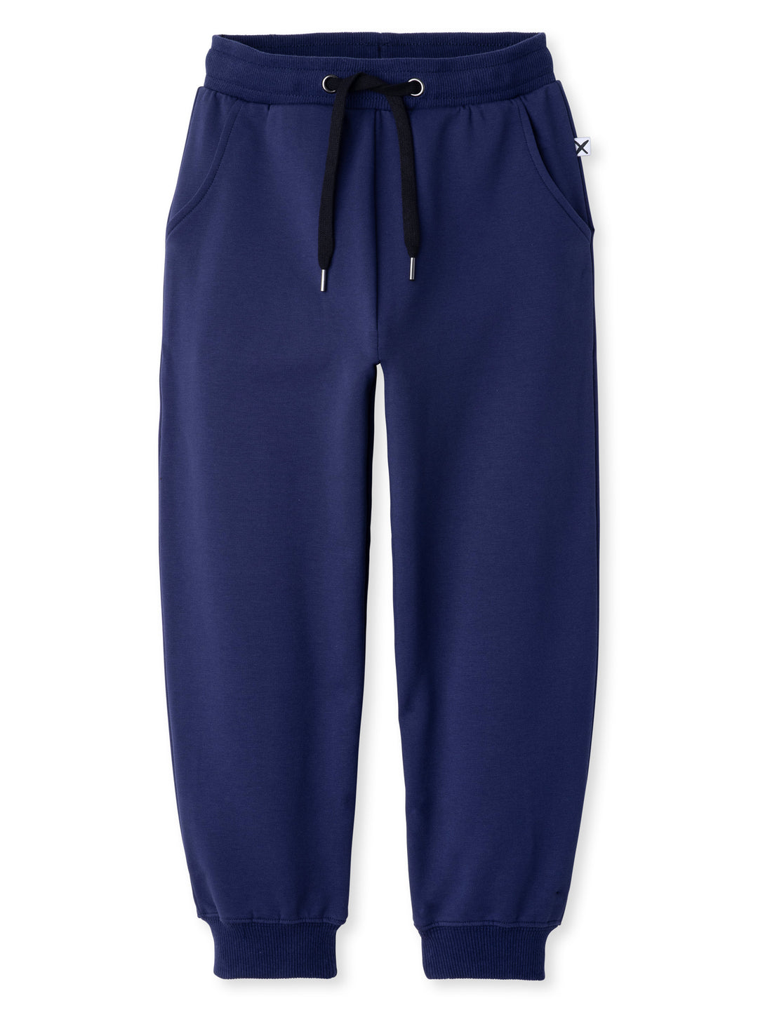 Minti kids clothing. Relaxed universal fit trackies with cosy side pockets, elasticated waistband, shoelace cord and 2x2 Rib cuffs. Small Minti embroidery on the back. 320 Gram // 95% Cotton // 5% Elastane.