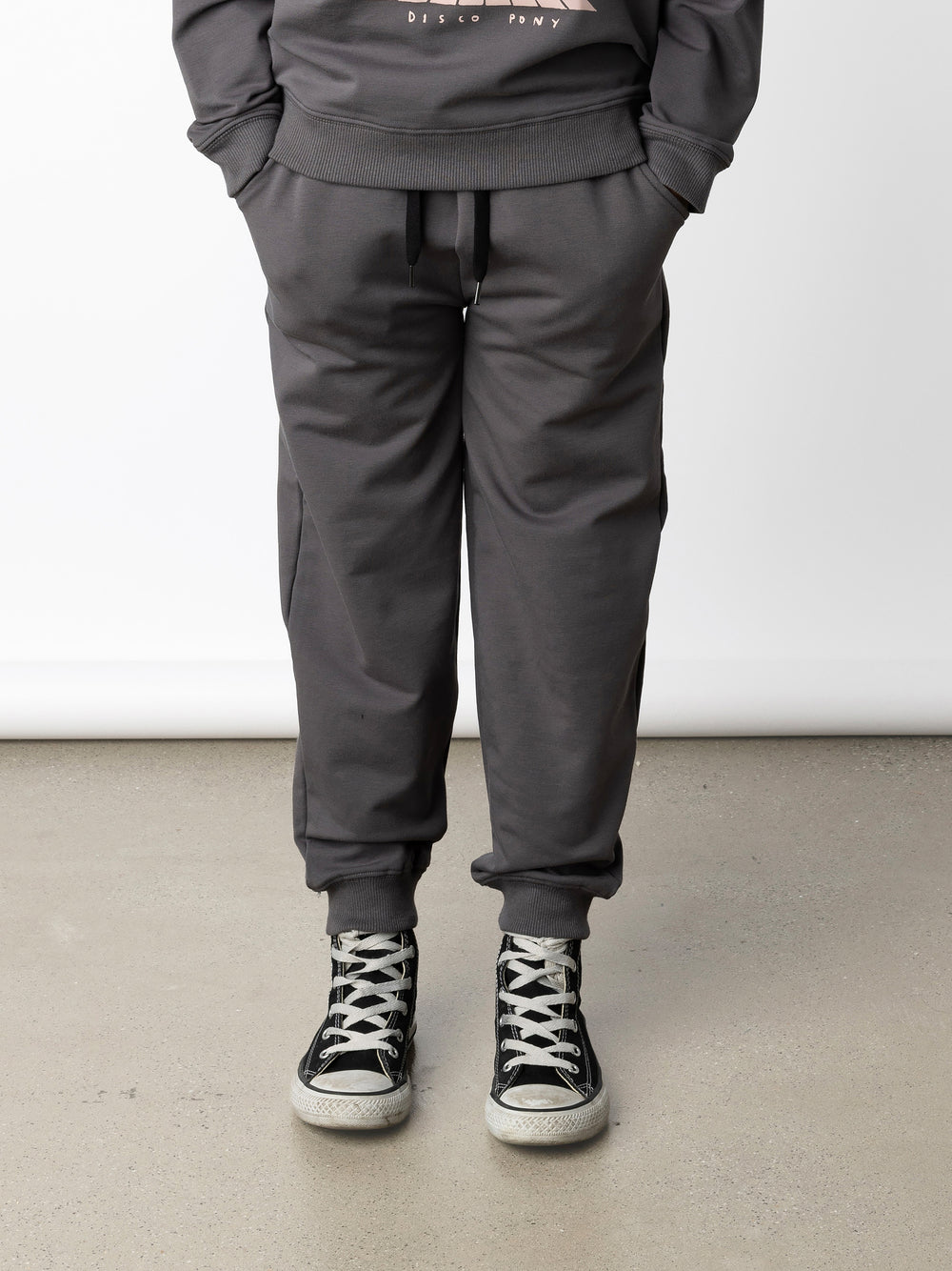 Minti kids clothing. Relaxed universal fit trackies with cosy side pockets, elasticated waistband, shoelace cord and 2x2 Rib cuffs. Small Minti embroidery on the back. 320 Gram // 95% Cotton // 5% Elastane.