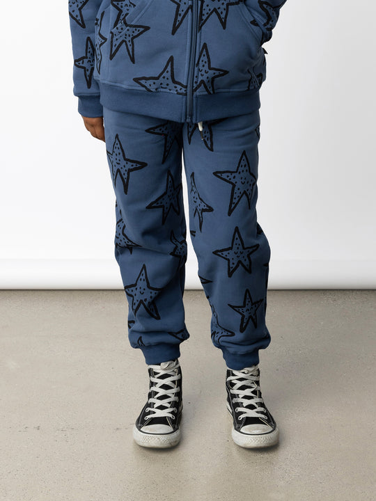 Minti kids clothing. Relaxed fit trackies with cosy side pockets, elasticated waistband, shoelace cord and 2x2 Rib cuffs. 330 Gram // Brushed Inside // 95% Cotton // 5% Elastane.