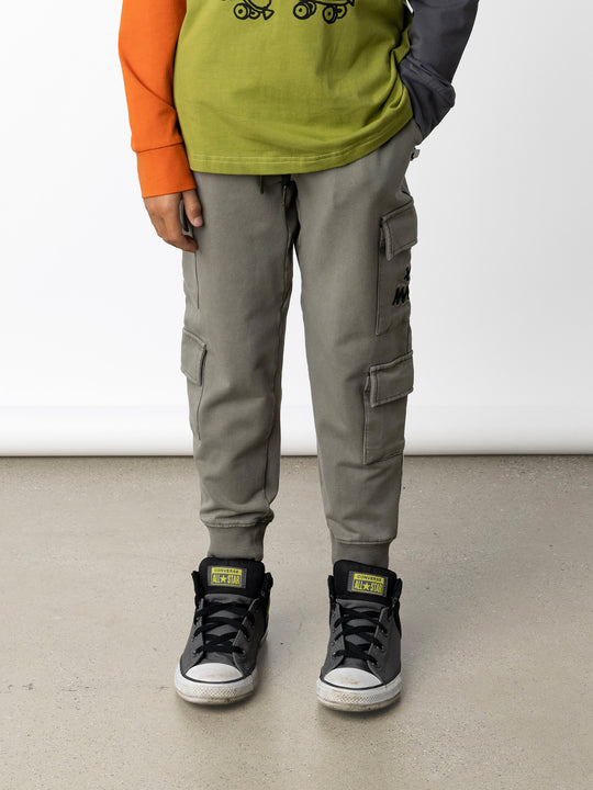 Minti kids clothing. Awesome trackies with slightly wider legs, elastic waistband, front pockets, shoestring cords and 4 super cool cargo pockets for treasures or cold hands. 260 Gram // 95% Cotton // 5% Elastane.