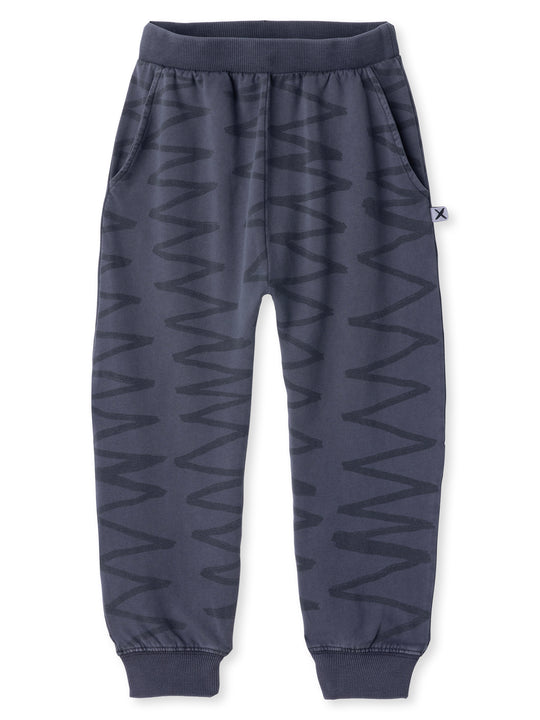 Minti kids clothing. Super cool baggy trackies with elastic waistband, front pockets, back pocket and 2x2 rib cuffs. 260 Gram // 95% Cotton // 5% Elastane.