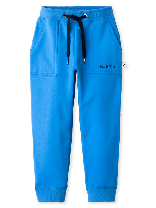Minti kids clothing. Loose leg trackies with elasticated waistband, shoelace ties, 2x2 rib cuffs and super cool boxy pockets. 330 Gram // Brushed Inside // 95% Cotton // 5% Elastane.