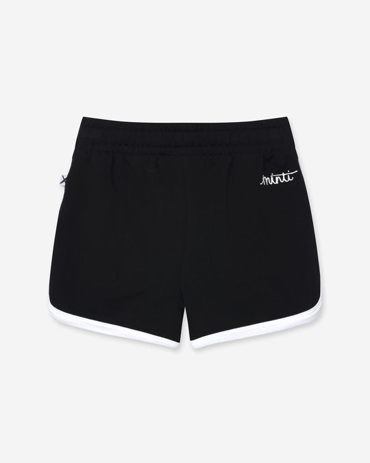Sprint Short in black and white, girls shorts by Minti, flat lay