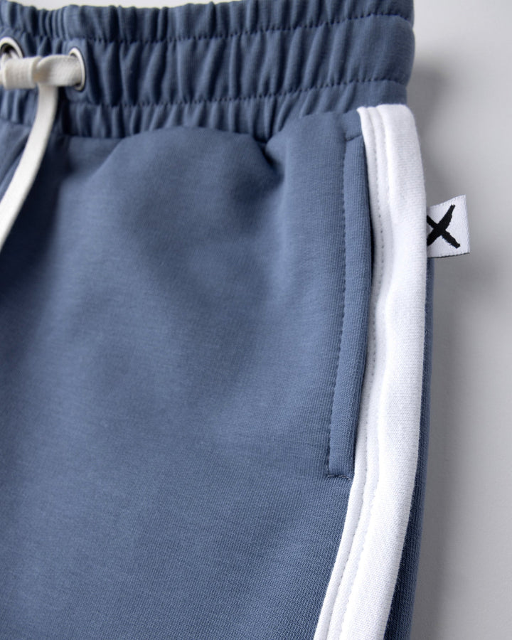 Close up detail of the Sprint Short in cornflower and white