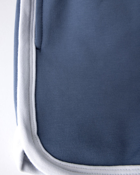 Close up detail of the Sprint Short in cornflower and white