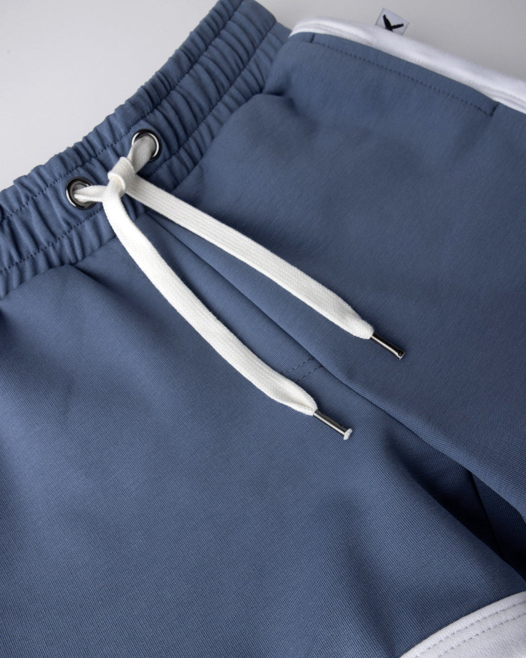 Close up detail of the Sprint Short in cornflower and white