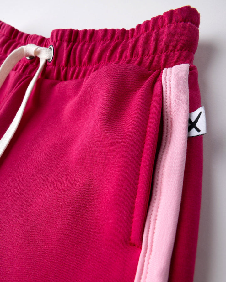 Close up detail of the Sprint Short in crimson and pink