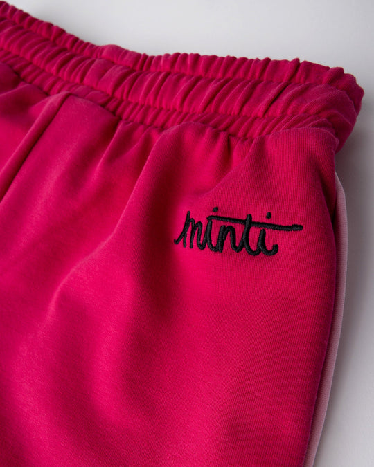 Close up detail of the Sprint Short in crimson and pink