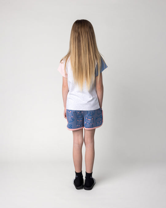 Kid wearing the Hi Cat Bear Short in cornflower and pink with the Hi Cat Bear Tee in white marle, blue and pink, back view