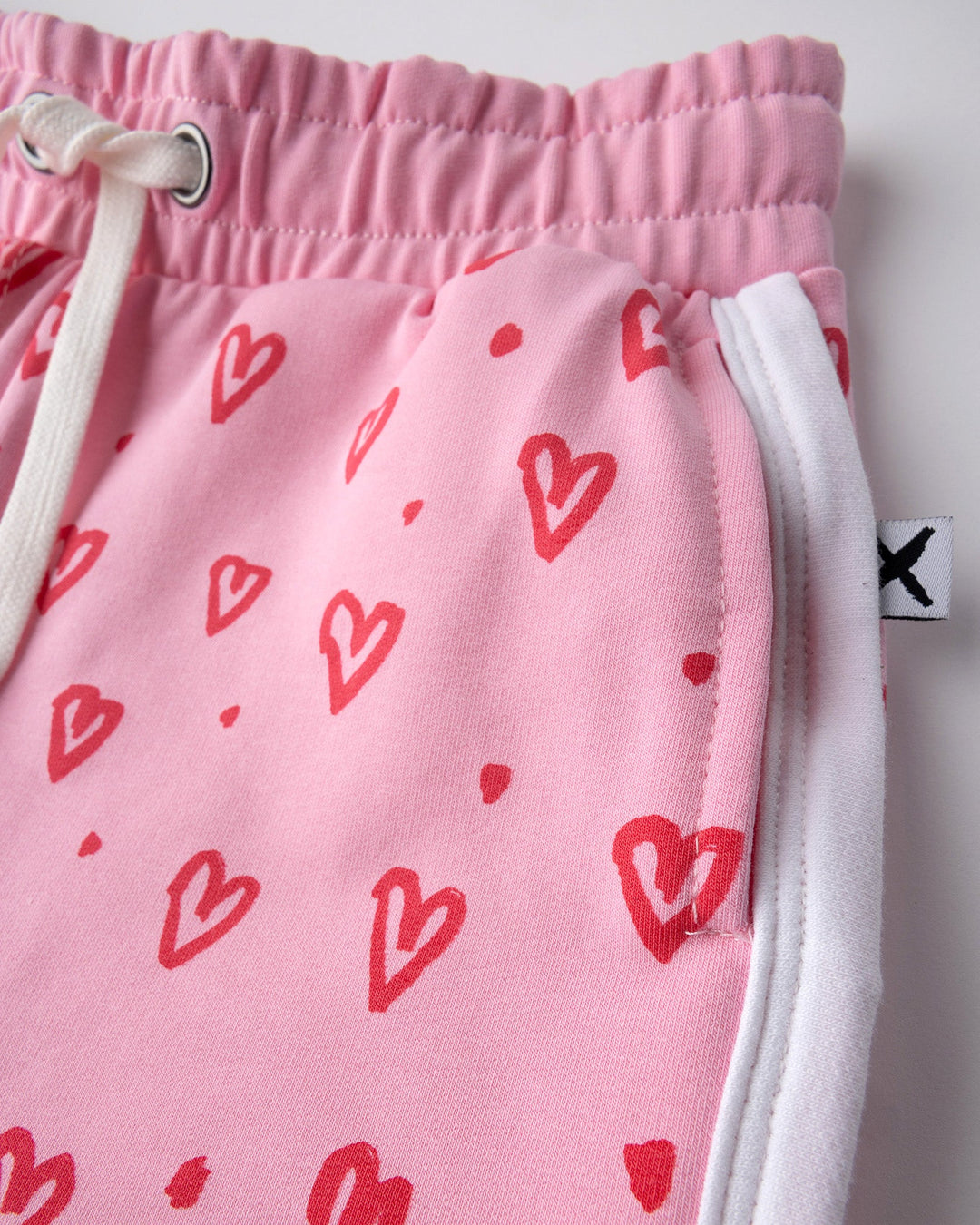 Close up of the Hearts Short print in pink and white