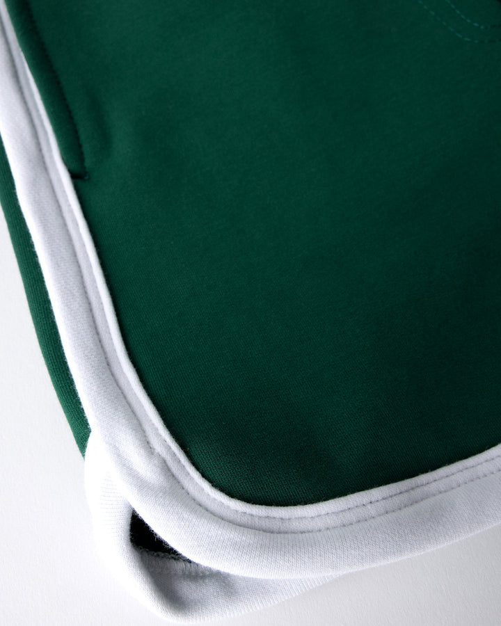 Close up detail of the Sprint Short in kelly green and white