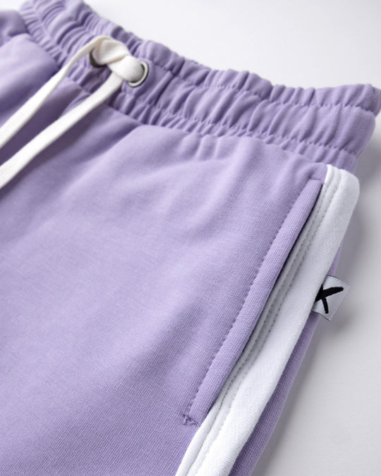 Close up detail of the Sprint Short in lilac and white