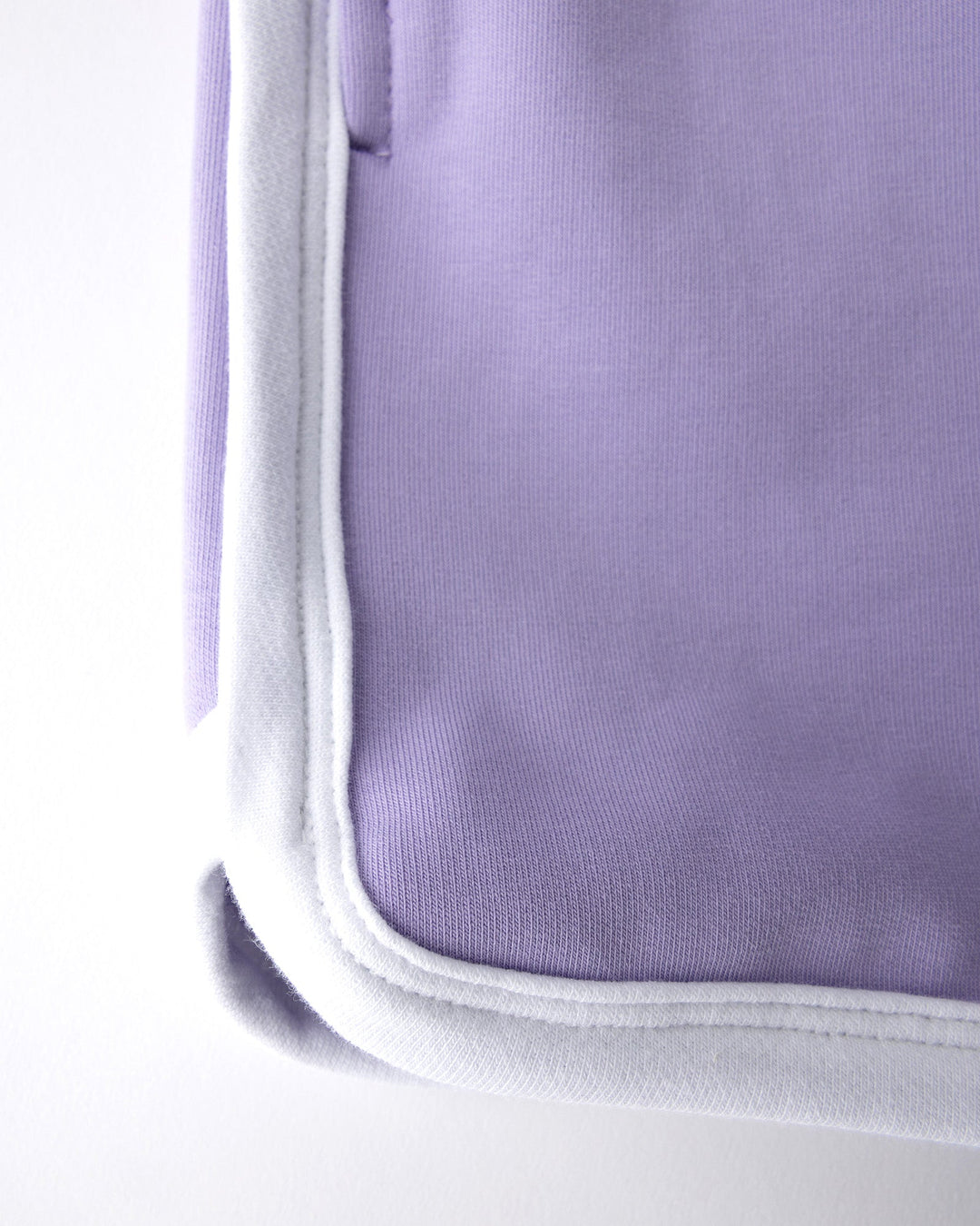 Close up detail of the Sprint Short in lilac and white
