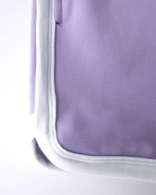Close up detail of the Sprint Short in lilac and white