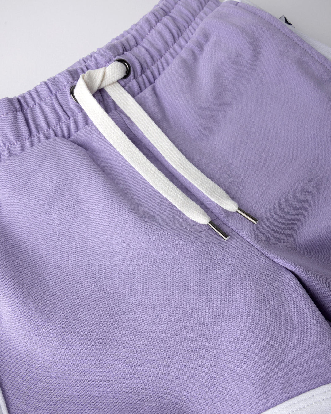 Close up detail of the Sprint Short in lilac and white