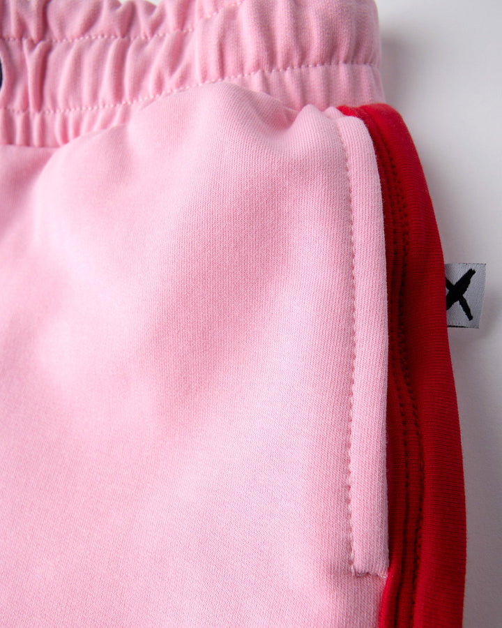 Close up detail of the Sprint Short in pink and red