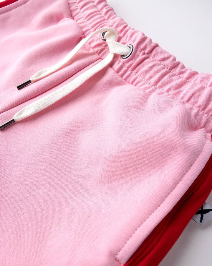 Close up detail of the Sprint Short in pink and red