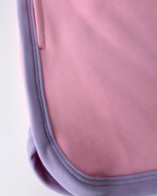 Close up detail of the Sprint Short in pink, purple and aqua