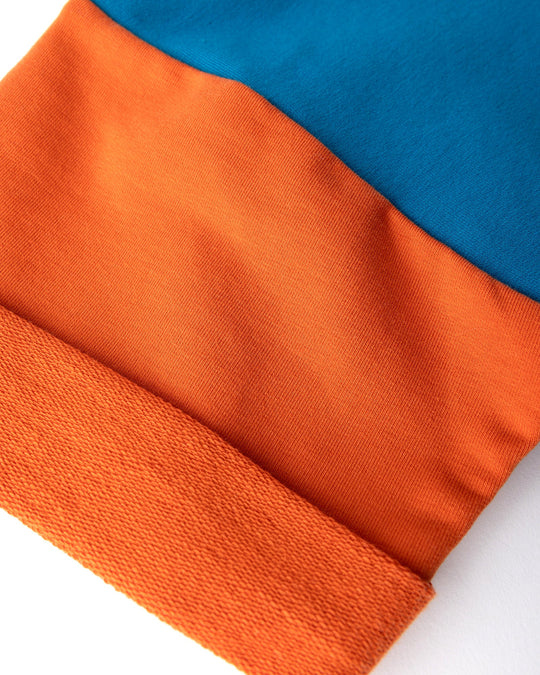 Close up detail of the Chill Sloth Short Sleeve Crew in teal, orange and grey marle