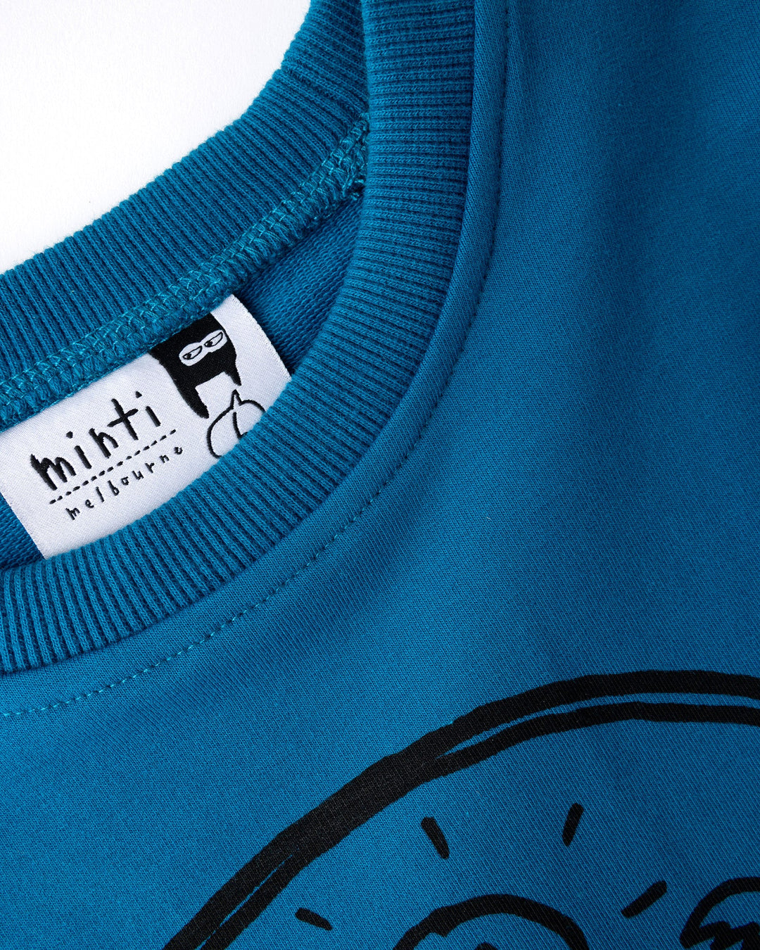 Close up detail of the Chill Sloth Short Sleeve Crew in teal, orange and grey marle